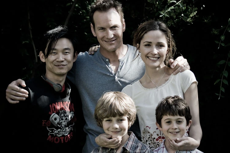James Wan and the original cast together outdoors